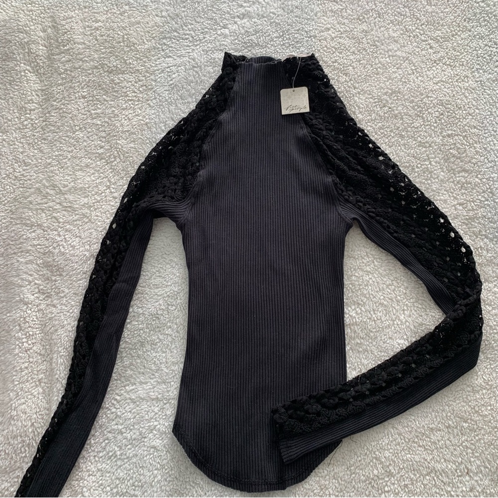 Free People mid Turtleneck Ribbed Top with detailed sleeves.